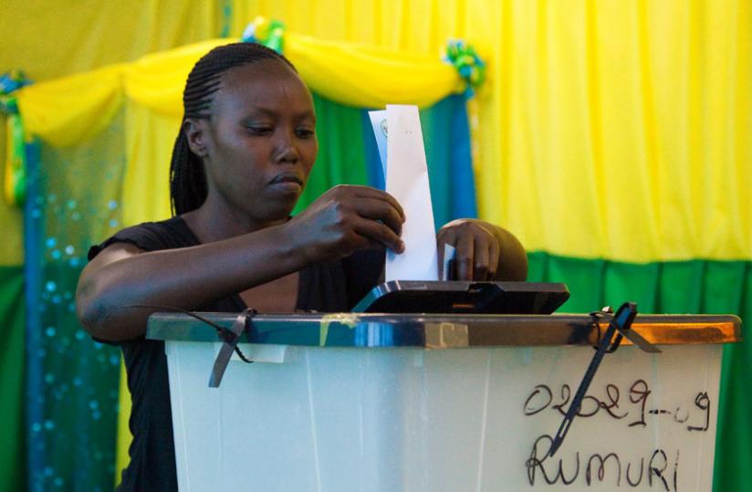 Voter casts ballot in Rwanda elections