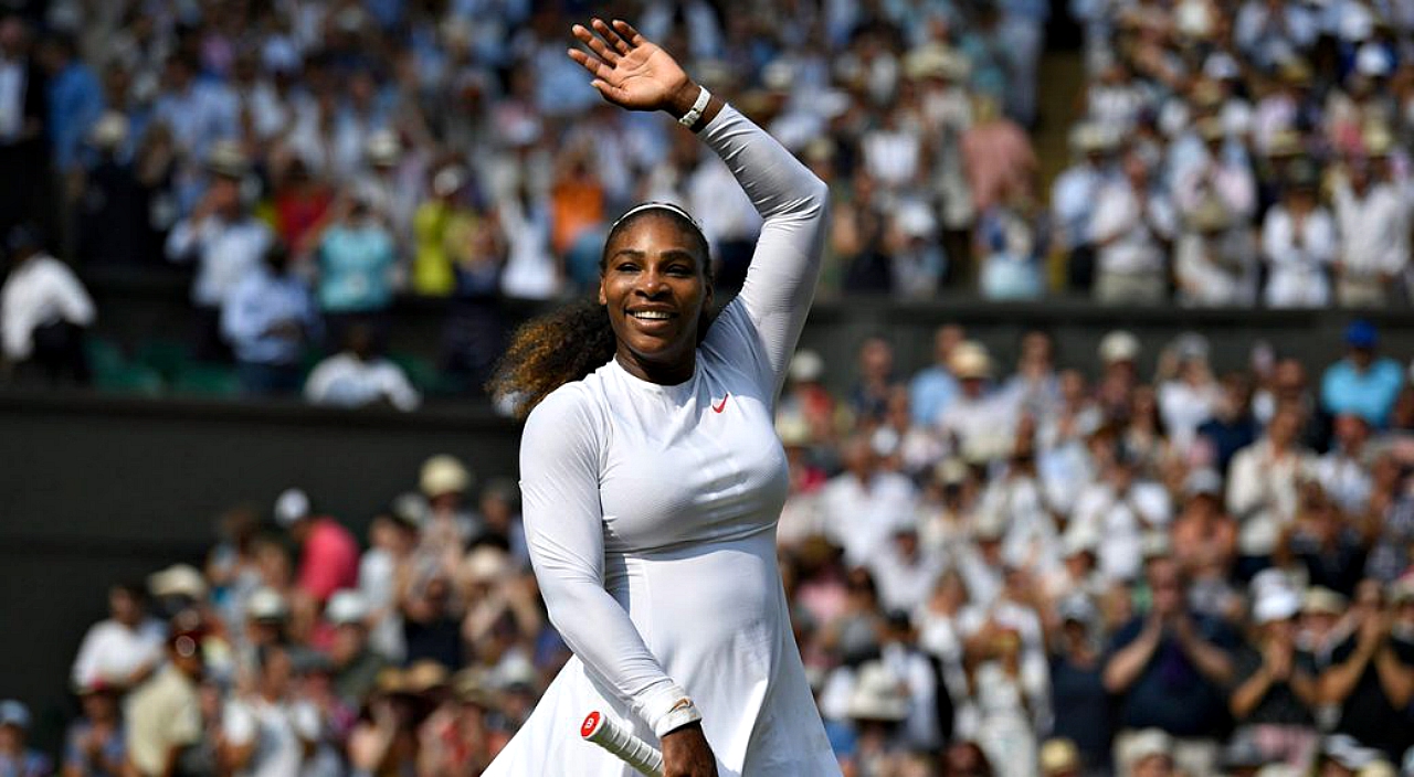 A jubilant Serena Williams celebrates after defeating Julia Goerges in their Wimbledom semi-final match, July 12, 2018.