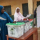 Nigerians vote for new president in tight election race