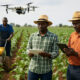 African farmers using smart agriculture technology like drones, sensors, and AI to drive a trillion-dollar agricultural revolution.