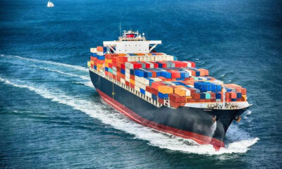 A large cargo container vessel navigating the open sea.