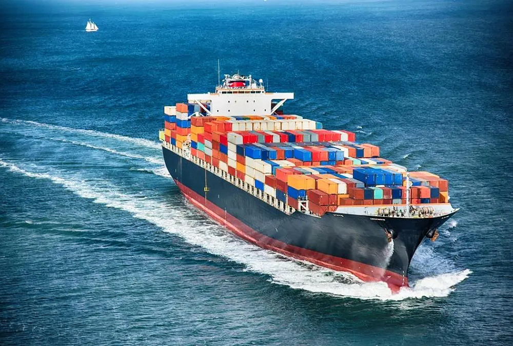 A large cargo container vessel navigating the open sea.