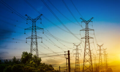 A power transmission line in Uganda, symbolizing the country’s recent 14% electricity tariff reduction driven by a stronger shilling and lower fuel import costs.
