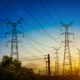 A power transmission line in Uganda, symbolizing the country’s recent 14% electricity tariff reduction driven by a stronger shilling and lower fuel import costs.