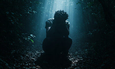 a person sitting alone in distress