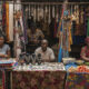 Small African business owners working in a local market, symbolizing the challenge of scaling enterprises across the continent.