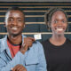 Ugandan entrepreneurs Samuel Muyita and Sandra Namboozo display plant-based Karpolax sachets used to extend fruit shelf life and reduce food waste.