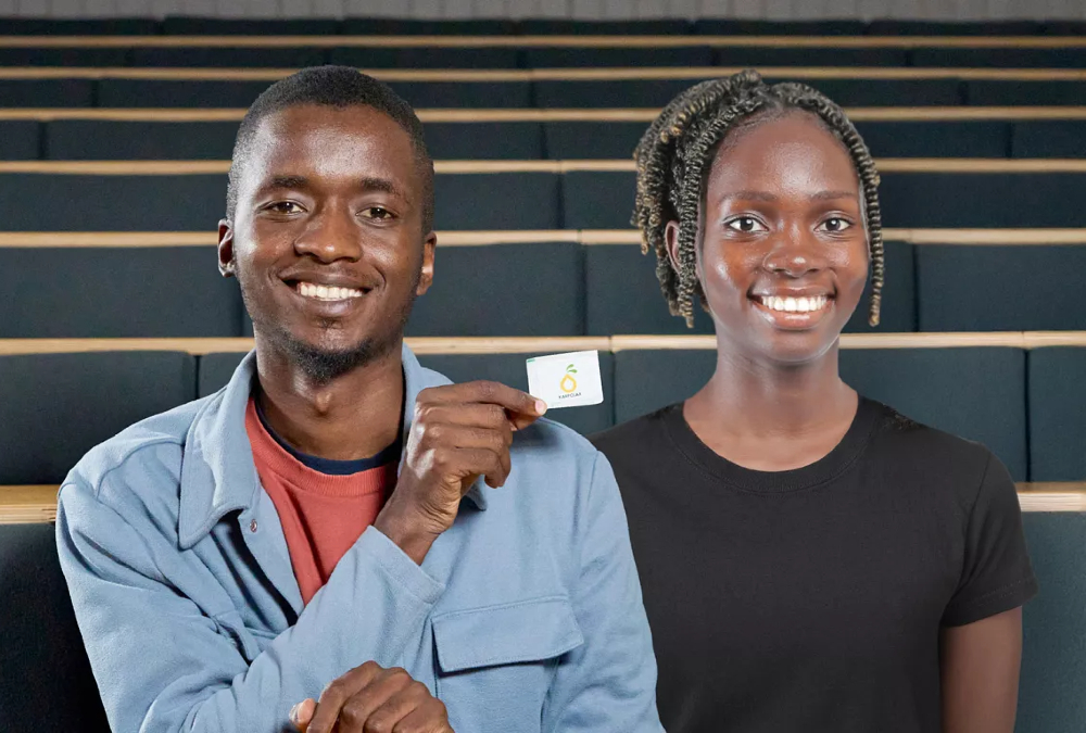 Ugandan entrepreneurs Samuel Muyita and Sandra Namboozo display plant-based Karpolax sachets used to extend fruit shelf life and reduce food waste.