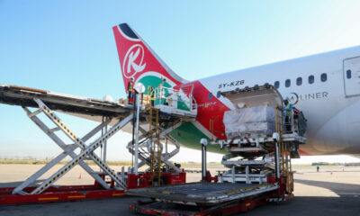 Cargo plane loading goods at an African airport terminal