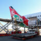 Cargo plane loading goods at an African airport terminal