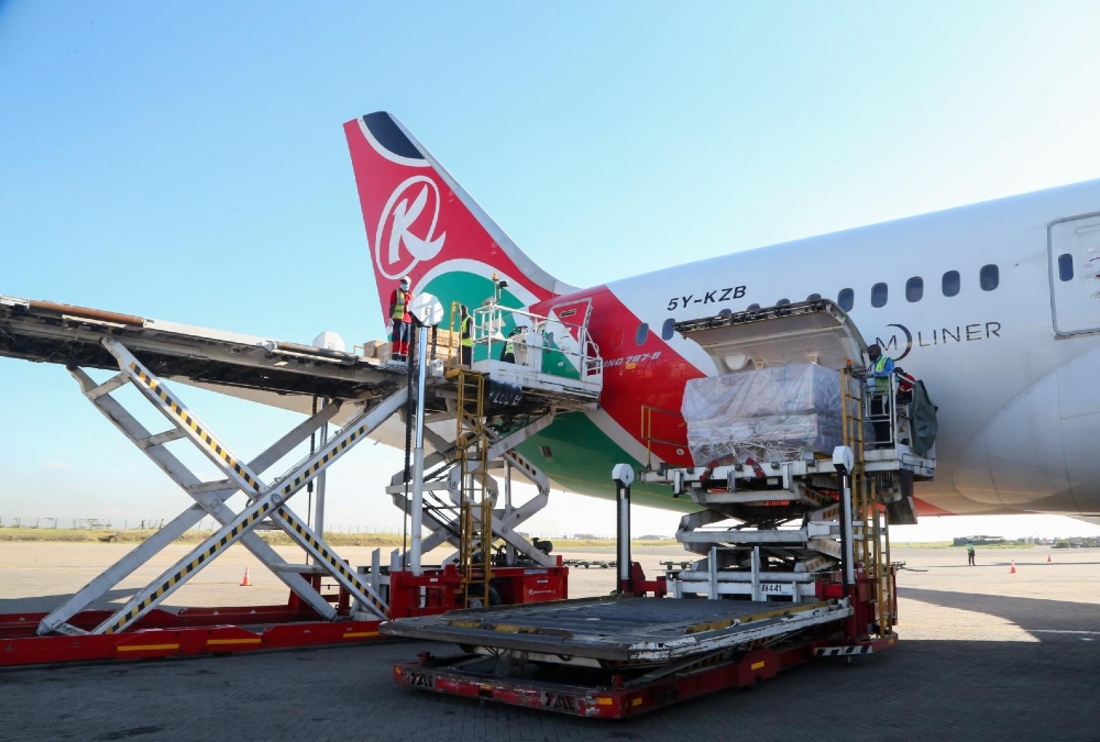 Cargo plane loading goods at an African airport terminal