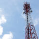 Tall telecommunications cell tower in South Africa, symbolizing Telkom's market presence amidst ongoing competition reforms and fiber optic expansion.