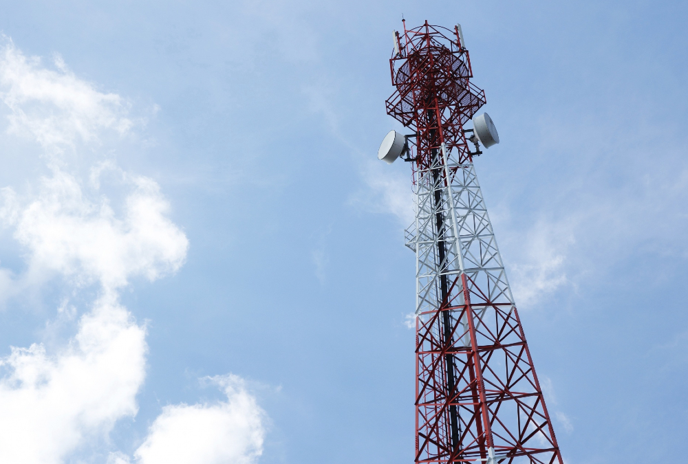 Tall telecommunications cell tower in South Africa, symbolizing Telkom's market presence amidst ongoing competition reforms and fiber optic expansion.