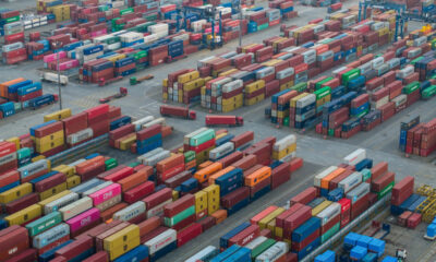 Illustration of shifting trade relations between the U.S., China, and Africa, with symbolic representations of tariffs, shipping containers, and African exports.