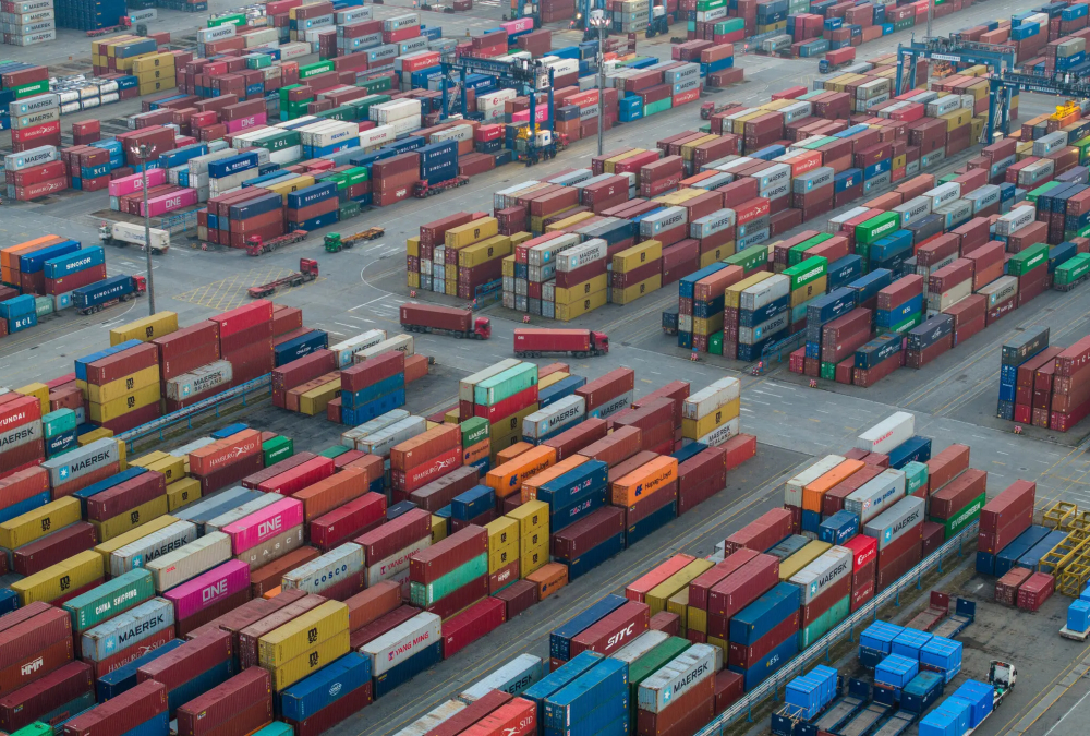 Illustration of shifting trade relations between the U.S., China, and Africa, with symbolic representations of tariffs, shipping containers, and African exports.