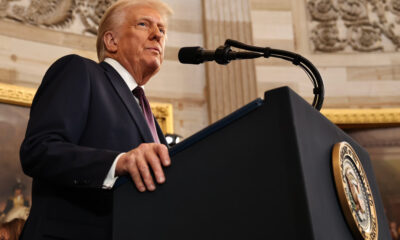 U.S. President speaking at a podium, symbolizing the global impact of presidential statements on international politics and security during times of uncertainty.