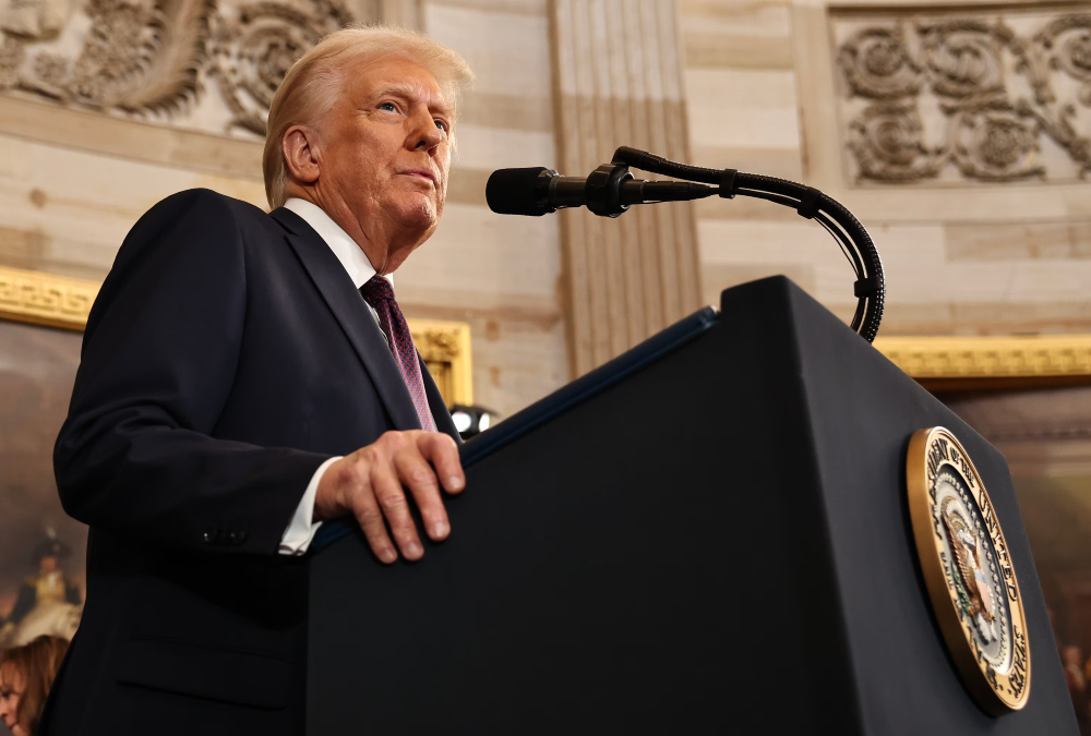 U.S. President speaking at a podium, symbolizing the global impact of presidential statements on international politics and security during times of uncertainty.