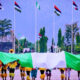 Nigerian Democracy Day celebration with citizens showing national pride and hope amid rising security concerns.