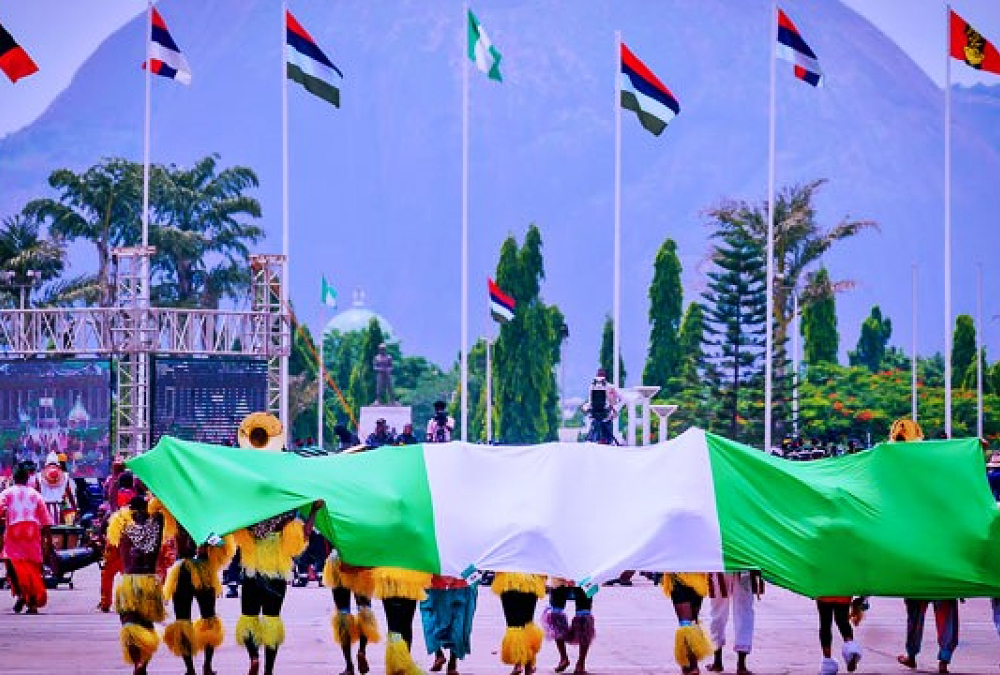 Nigerian Democracy Day celebration with citizens showing national pride and hope amid rising security concerns.