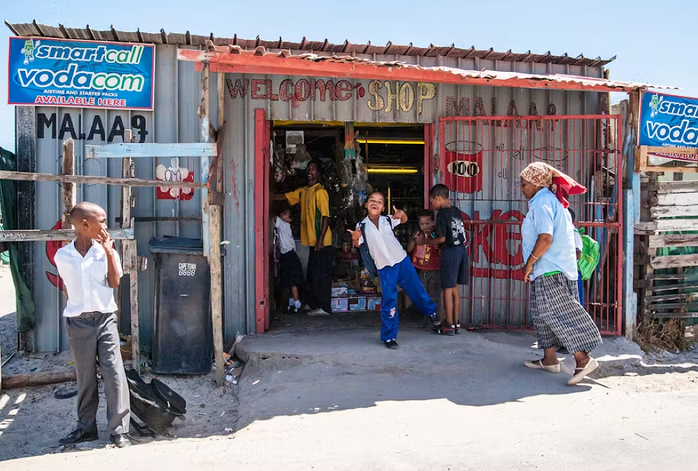 South African township spaza shop representing micro-enterprises supported by government funding amid calls for broader entrepreneurship reform