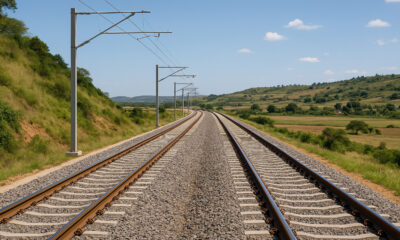 A modern Tanzanian railway line connecting inland mining and agricultural regions to the ports of Dar es Salaam and Tanga, symbolizing East Africa’s growing trade infrastructure.