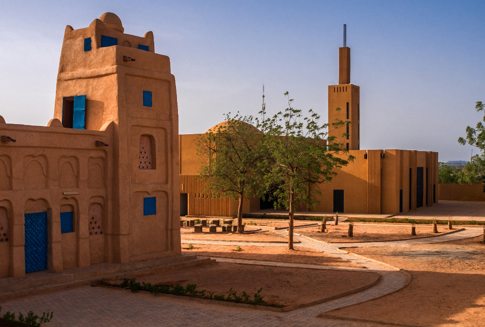 Traditional African architecture and community life reflecting sustainable living and cultural resilience.