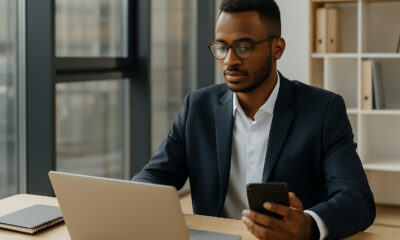 African entrepreneur in a modern workspace using digital technology, symbolizing Africa’s rise as a global growth frontier and strategic investment opportunity in 2025.