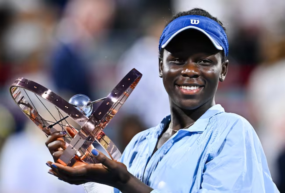 Victoria Mboko celebrates after defeating Naomi Osaka to win the 2024 National Bank Open in Montreal, becoming the first Canadian to claim the title in the city and marking a breakthrough moment in her rising tennis career.