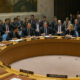 United Nations Security Council chamber with delegates debating global governance reform