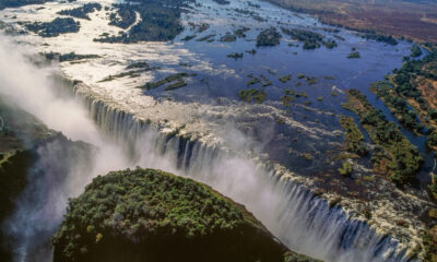 A panoramic view of Victoria Falls and the Zambezi River in Zambia, highlighting the country’s natural beauty, cultural richness, and role as Southern Africa’s economic hub.