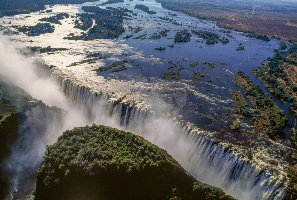 A panoramic view of Victoria Falls and the Zambezi River in Zambia, highlighting the country’s natural beauty, cultural richness, and role as Southern Africa’s economic hub.