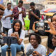 Diverse African youth using smartphones and cameras to tell their own stories online