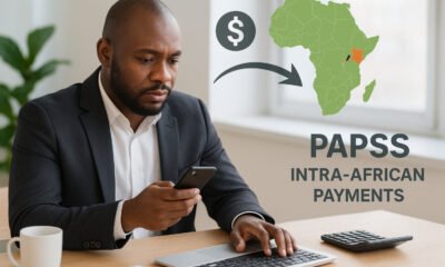 African businessman sending money to a supplier in another African country, highlighting high transaction costs and the benefits of PAPSS for faster, cheaper intra-African payments.