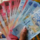 Ghana cedi banknotes displayed during the Cedi@60 anniversary launch event in Accra, celebrating 60 years of national currency and monetary sovereignty.
