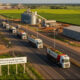 Cargo trucks on a modern African highway near an agro-processing zone, symbolizing industrial corridor development and regional economic growth under AfCFTA.