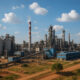 A modern African industrial complex with factories and processing plants, representing Africa’s potential for industrial growth, job creation, and sustainable economic development.