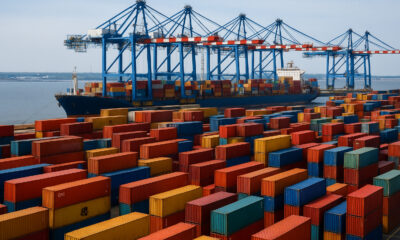 Global shipping containers at a busy port, symbolizing resilient global supply chains and rising trade growth in sub-Saharan Africa despite global tariffs and geopolitical tensions in 2025