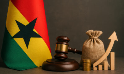 The Ghanaian flag alongside symbols of governance and growth, symbolizing stability as a national economic strategy.