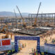 Construction site of Africa's first battery gigafactory in Kenitra, Morocco, symbolizing the continent's strategic shift from raw mineral exports to green manufacturing and participation in the global EV supply chain.