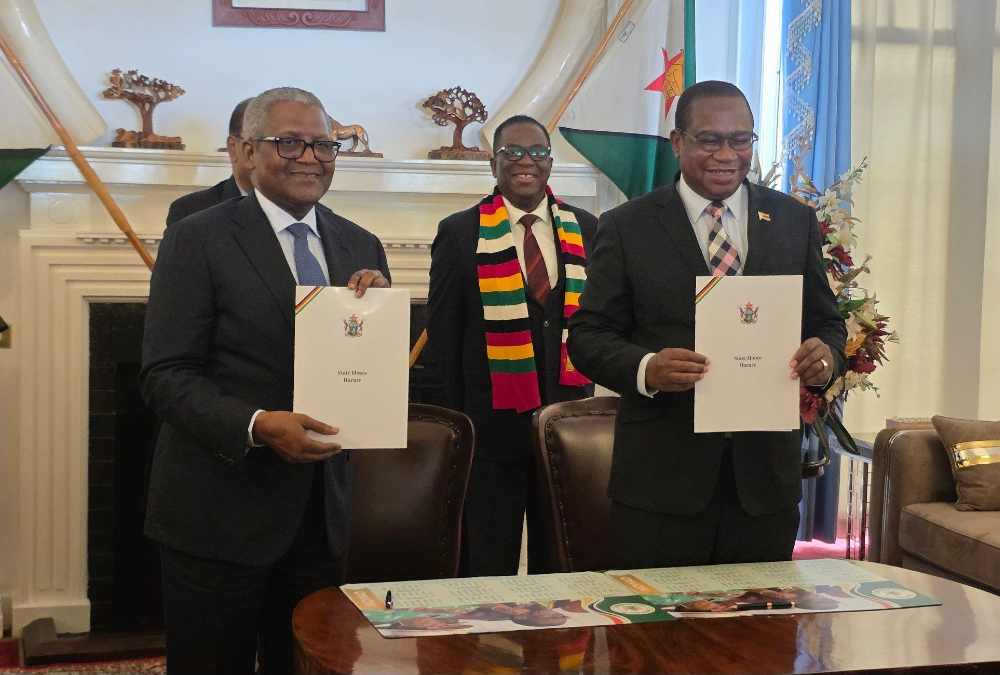 Aliko Dangote signing $1 billion investment deal in Zimbabwe for cement manufacturing, coal mining, and power generation to support industrial growth.