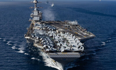 U.S. military ships and aircraft near Venezuela coast during drug interdiction operations, reflecting historical patterns of American intervention in Latin America and rising Caribbean tensions.