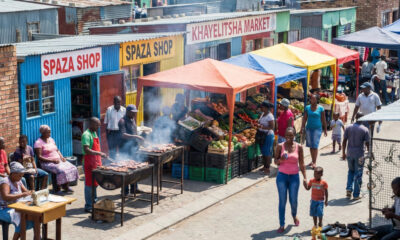 Vibrant street market in a South African township with spaza shops, food vendors, and entrepreneurs at work—showcasing the structured, productive reality of the so-called "informal" economy.