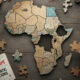 A map of Africa made of incomplete puzzle pieces, visualizing the continent's data gaps and the need for pragmatic solutions.