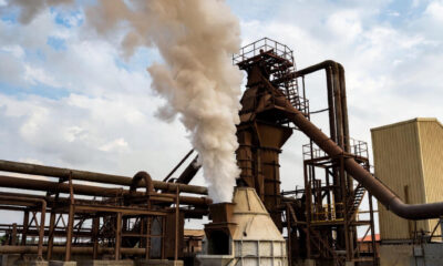 industrial cement kiln with rising smoke, symbolizing Africa’s energy challenges in cement production despite abundant limestone resources.