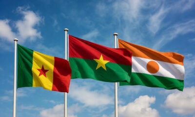 Flags of Mali, Burkina Faso, and Niger representing Alliance of Sahel States