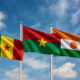 Flags of Mali, Burkina Faso, and Niger representing Alliance of Sahel States
