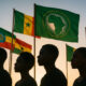 Silhouettes of diverse African youth looking forward with determination and African Union flags representing 54 nations with potential for continental unity and geopolitical transformation