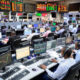African stock exchange trading floor with increased activity from institutional and retail investors