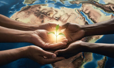 A thoughtful depiction of generational stewardship in Africa—hands passing a glowing seedling over a map of the continent, symbolizing ethical legacy, responsibility, and hope for the unborn.