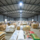 Warehouse filled with surplus rice, maize, and soybeans in Ghana highlighting the grain surplus crisis and food insecurity challenges.